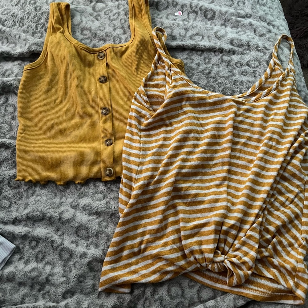 two yellow tank tops
